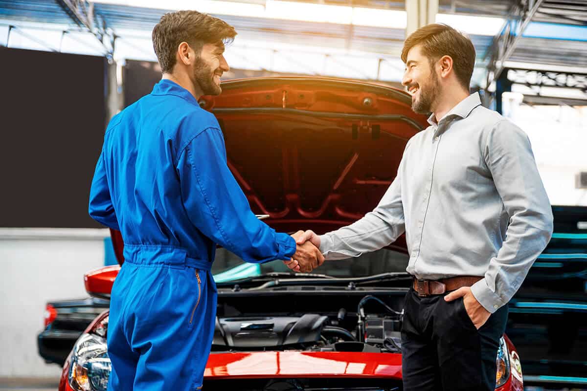 client and technician shake hands